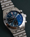 Breitling Chronomat AB0134101C1A1 - frontaal aanzicht met blauwe wijzerplaat en tachymeterschaal
