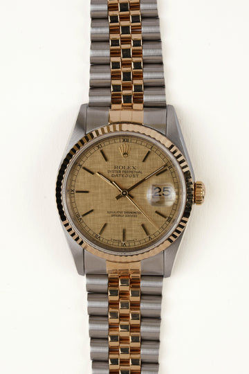 Rolex Datejust 16233 - vooraanzicht van de champagne wijzerplaat, geribbelde gouden bezel en armband