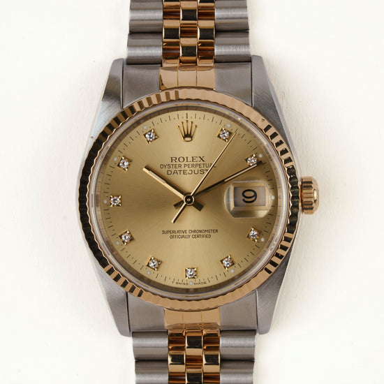 Rolex Datejust 16233 - vooraanzicht van de champagne wijzerplaat met diamanten indexen, geribbelde gouden bezel en armband