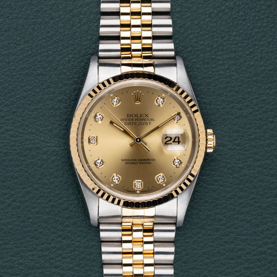 Rolex Datejust 16233 Champagne Diamond Dial - frontaal aanzicht met diamanten uurmarkeringen en Jubilee band