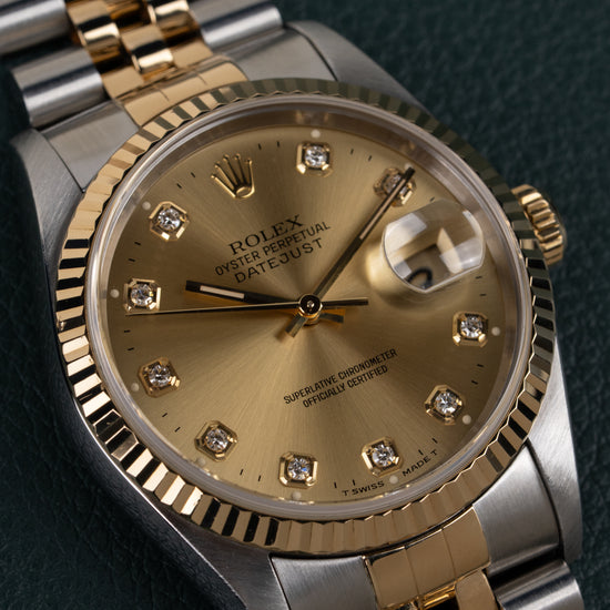 Rolex Datejust 16233 Champagne Diamond Dial - close-up van wijzerplaat en fluted bezel met kroon zichtbaar rechts