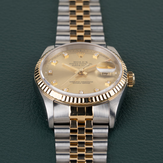 Rolex Datejust 16233 Champagne Diamond Dial - close-up van wijzerplaat en fluted bezel onder een hoek