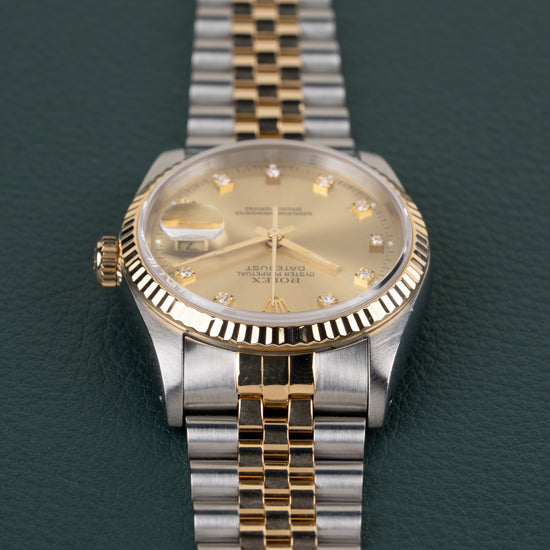Rolex Datejust 16233 Champagne Diamond Dial - zijaanzicht van de kast met kroon