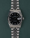 Rolex Datejust 16234 Black Diamond Dial 1994 - Volledig horloge recht van boven met zwarte wijzerplaat met diamanten uurmarkeringen, gefacetteerde stalen bezel en jubilee-band